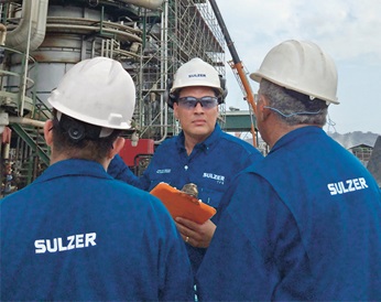 Rodolfo Amezquita, Sales Manager at Sulzer with two colleagues in front of a site