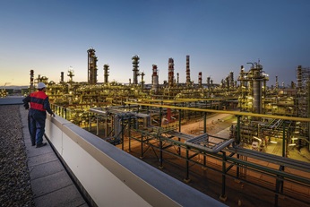 An engineer is looking to a oil refineries 