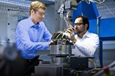 Two engineers manufacturing an impeller