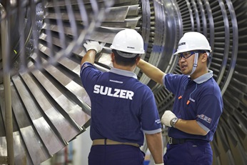 Two engineers with turbines