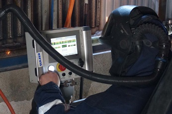 Operator setting the weld overlay installation