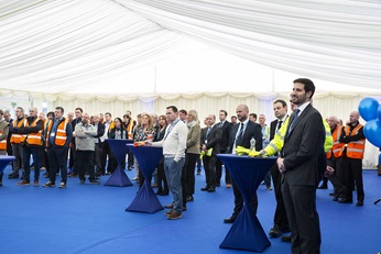 Wexford factory employees and guests watching video message by Minister for Enterprise Trade & Employment