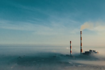 Industrial plant appearing through the clouds