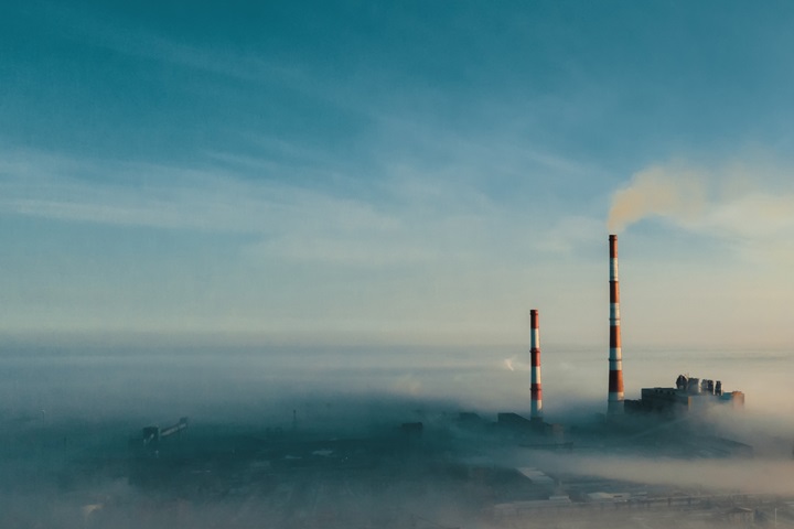 Industrial plant appearing through the clouds
