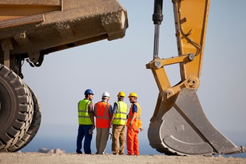 men standing together at a construction site