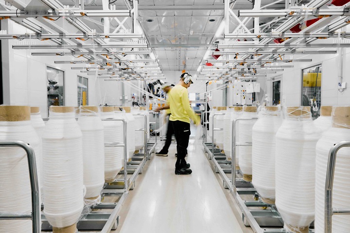 spinnova white factory with worker in it