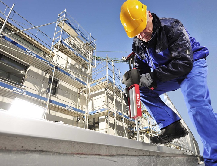 Man with static mixer at construction site