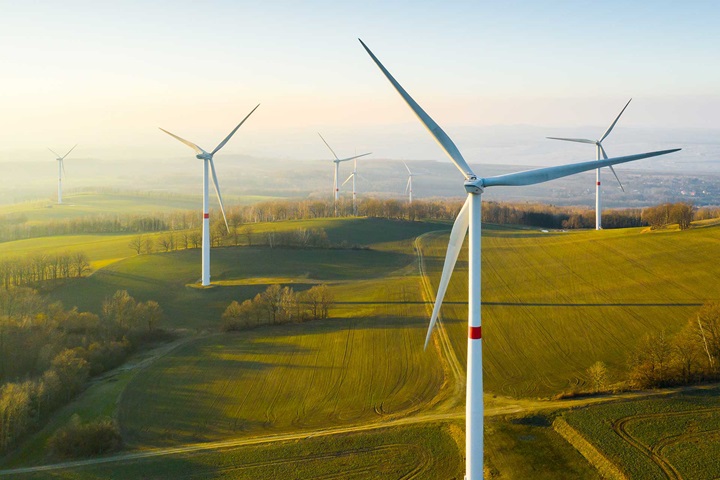 Wind turbines in green landscape