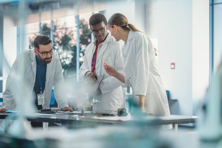 Sulzer lab technicians reviewing water sample analysis to diagnose industrial water treatment steps for contaminant and nutrient removal 