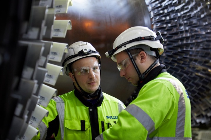 Sulzer Specialists inspecting new blades mounted into Gas Turbine