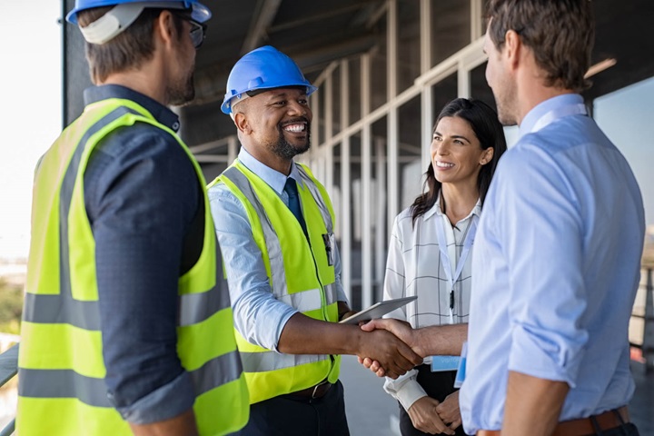 Group of working people shaking hands