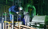 korean engineers installing retrofitted pumps
