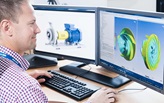 Engineer at PC with 3D CAD design