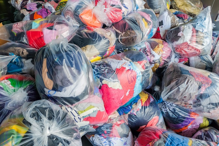 Old clothes in plastsic bags for donation or recycling
