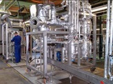 Skid-mounted reaction system for PMMA production at semi-industrial scale