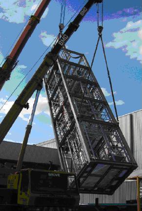 Loading of a skid-mounted solvent recovery and purification unit with five floors moved with a crane
