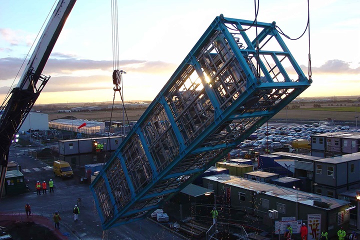 Skid-mounted solvent recovery unit with six floors erected by a crane at a customer's site