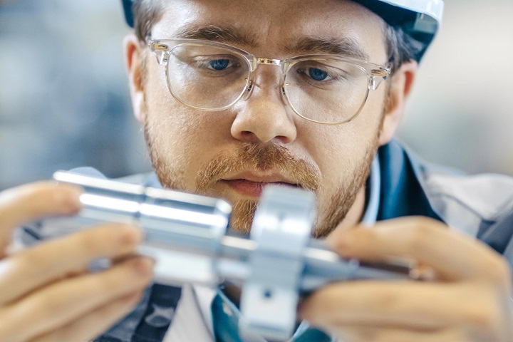 Engineer working on part