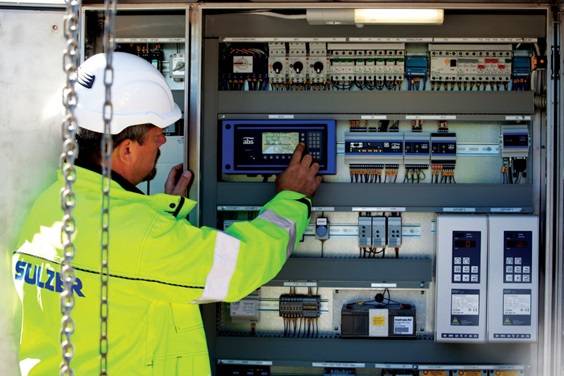 A man looking at a Control System