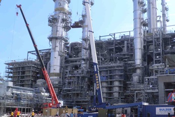 Tower internal installation at a customer site with several cranes