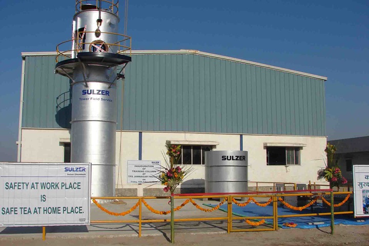 Sulzer Tower Field Service Workshop with safety banner in front