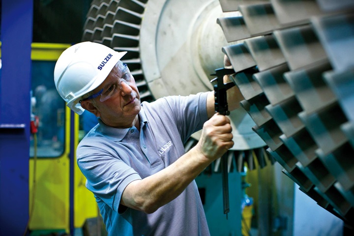 Engineer repairing a turbo machinery at Service center in Birmingham, UK
