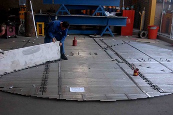Operator installing the Shell Grid tray on the floor