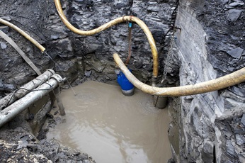 Submersible drainage pump XJ in pit at site for dewatering in construction