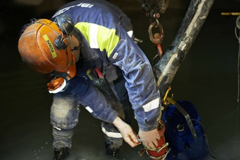 Technician installing a dewatering pump in mine in Garpenberg, Sweden