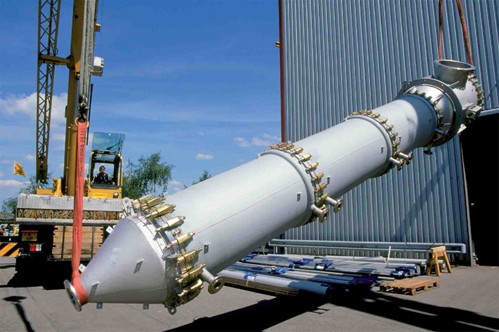 Crane in front of a mill unloading a Sulzer device