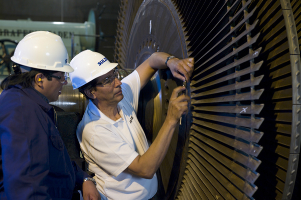 Two engineer repairing a rotator